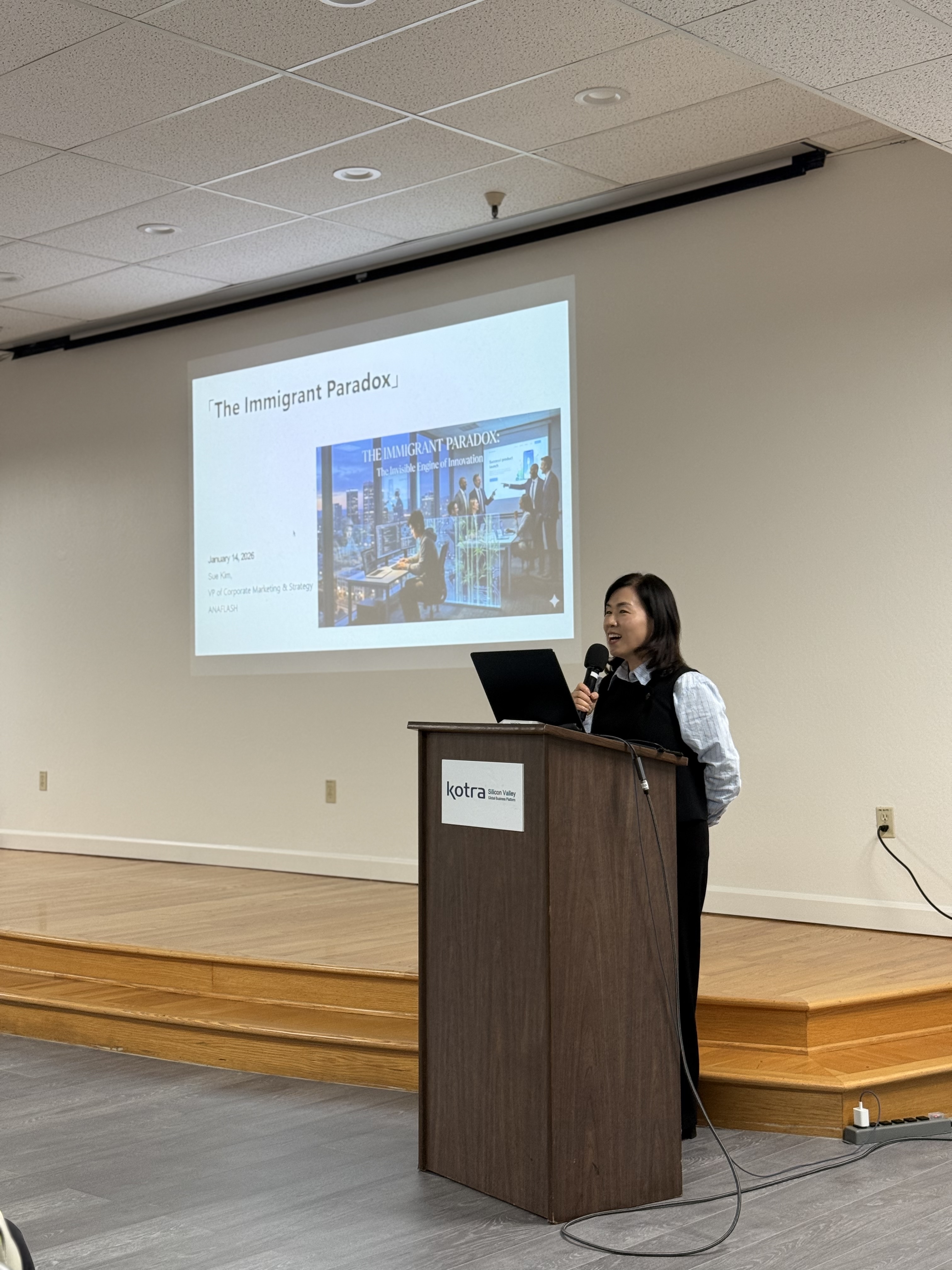 Sue Kim speaking at an event